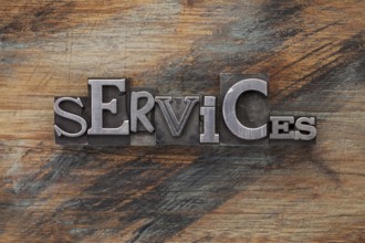 Services - word in vintage letterpress metal type blocks on a grunge painted wood