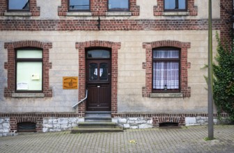 Lontzen, Walloon region, Belgium July 25, 2024 - The village library, a colorful brick stone facade