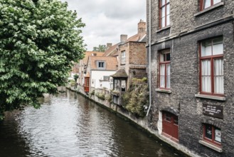 Bruges, Belgium, July 29, 2016: Canal scene in the city of Bruges. The historic city centre is a