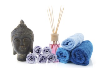 Stilllife with wellness items as buddha towels and scented sticks