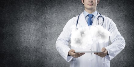 Cropped image of successful young medical industry employee in white sterile suit presenting cloud