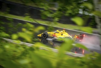 ALEX PALOU (10) of Barcelona, Spain comes through turn 12 (Canada Corner) during a wet practice