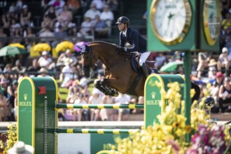 Ben Maher of Great Britain and riding Dallas Vegas Batilly compete in the first round of the 1.60m