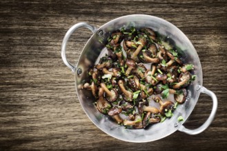 Fried shiitake mushrooms in garlic herb and olive oil tapas snack