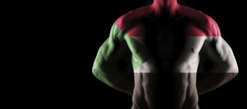Sudan flag on muscled male torso with abs, black background