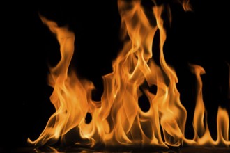 Fire flame on black background. Blaze fire flame textured background
