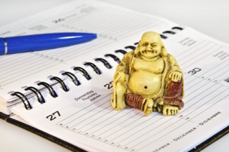 Buddha statute sitting on schedule in the office