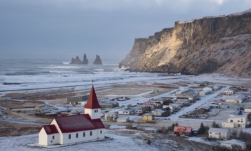 Vik Icelandic village in the Southeast Iceland covered in Snow in Spring