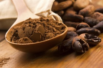 Cocoa (cacao) beans on natural wooden table, lodz, poland