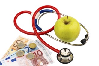 An apple and a stethoscope at a doctor's surgery. Symbolic photo for healthy and vitamin-rich