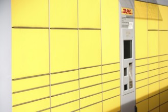 Mainz, Germany - May 27, 2017: Lockers or stacked and lined up parcel boxes with a DHL customer