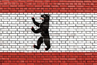 Berlin flag painted on brick wall