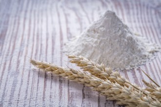Rye wheat ears flour on wooden background food and drink concept
