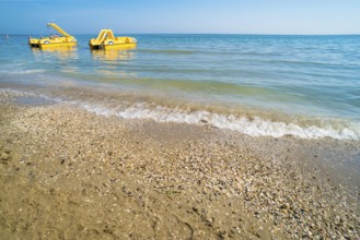 Yellow lifeboat on the beach. Italian beach