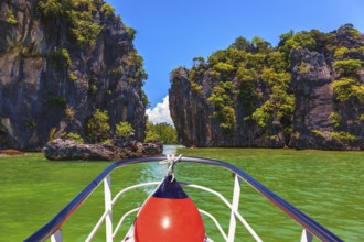A boat trip with a red lantern. The holiday in Thailand. Bay in the Andaman Sea and exotic island