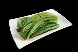Soy sauce poured over the Asian vegetable Choy Sum