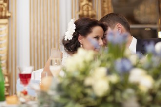 Bride and groom sharing a special tender moment at the wedding leaning with their heads close