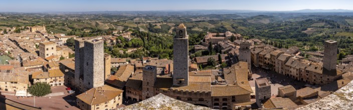 Wide panoramic view over downtown San Gimignano, Torri dei Salvucci and Torre Rognosa in the