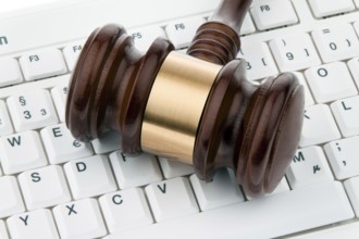 Judge's gavel and keyboard. Legal certainty on the Internet. Web auctions. Austria