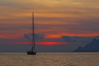 Sailing yacht at sunset, Gulf of Porto, Corsica