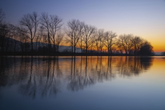 Dusk on the Berounka river, Czech Republic. Symmetry landscape at sunset