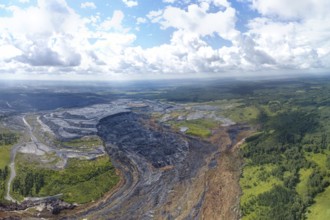 Aerial landscape with coal mine. Environmental disaster - a coal mine dump landslide destroyed a
