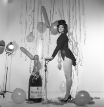 Champagne in the 1950s. A young woman in a scene that clearly is meant to suggest something to