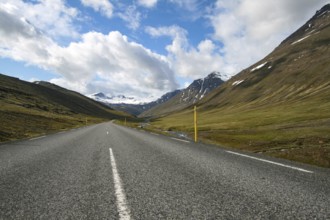 Road in the valley beckons with a journey into the unknown