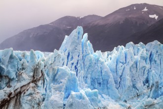 The glacier Perito Moreno. On the surface of the glacier formed Calgaspors - penitent firn.