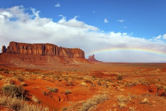 Navajo Indian Reservations. USA. Monument Valley Sentinel Mesa and the bright rainbow. Monument