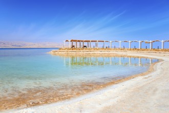 The drainless salt lake in the Middle East. Dead Sea. Israel. Evaporated salt forms ?rystals on the