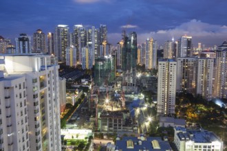 Construction works in residential area of Kuala Lumpur with high-rise apartment blocks. City