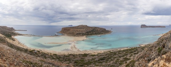 A panorama picture of the blue water of Balos Beach and the nearby landscape of the Gramvousa