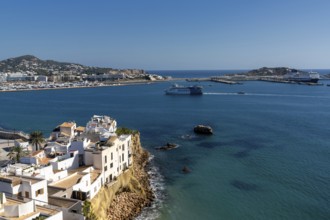 Ibiza, Spain, 1 February, 2024: view of Eivissa town and harbour with a ferry arriving in port