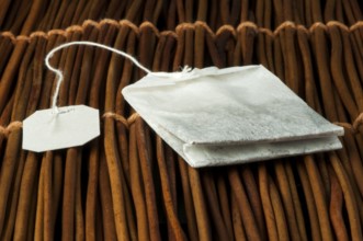 Tea bag close up on wooden base