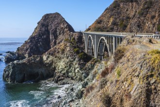 Great arch viaduct runs along the Pacific coast. California highway number 1. USA