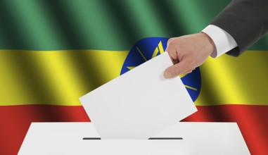 The Ethiopia flag and the hand with the bulletin about the ballot box