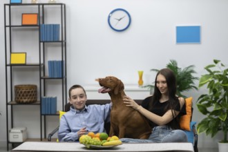 In a stylishly designed home environment, a boy and a girl are happily enjoying delightful moments