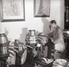 History of milk and cream making machinery. A man in a museum of separators. Machines made for the