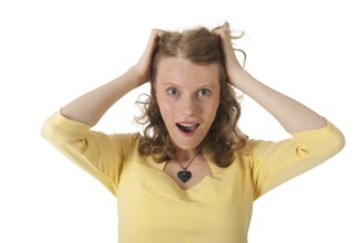 Blond woman surprised with hands in hair