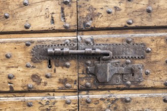 Close up of rustic old door in Spoleto, Italy