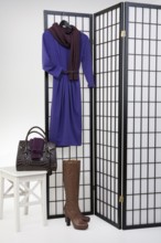 Woman's clothing and accessories on checkered folding screen