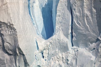 Close-up of a glacier with impressive ice formations and cool blue tones, The eternal ice of