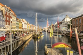 Copenhagen, Denmark, August 11, 2016: Nyhavn a cloudy day. It´s a 17th-century waterfront, canal