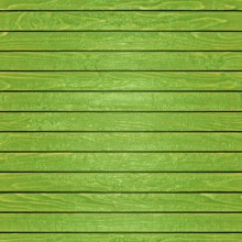 Green painted wooden planks creating a rustic and textured background, ideal for design projects