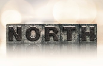 The word NORTH written in vintage ink stained letterpress type