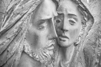 Bas-relief in bronze representing The Pity of Michelangelo. Faces of Holy Mary mother and Jesus