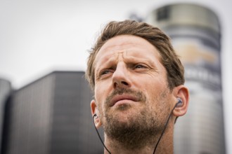 NTT INDYCAR SERIES driver, ROMAIN GROSJEAN (77) of Geneva, Switzerland stands for the national