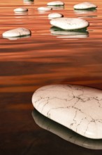 An image of some nice white step stones in the evening sea