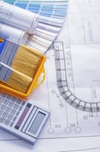 Set of tools calculator paintbrushes in paintcan color palette rolled blueprints